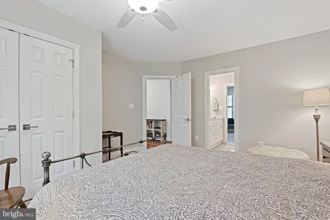 a bathroom with a double vanity sink toilet and shower