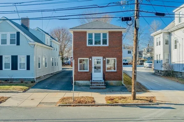 a front view of a house with garage