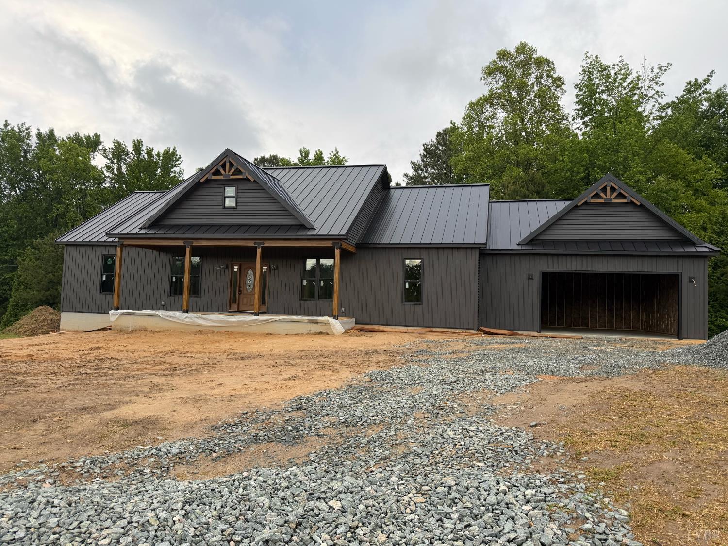 2794 Cow Road Buffalo Junction, VA 24529 - Photo 1 of 16 a front view of a house with a garden