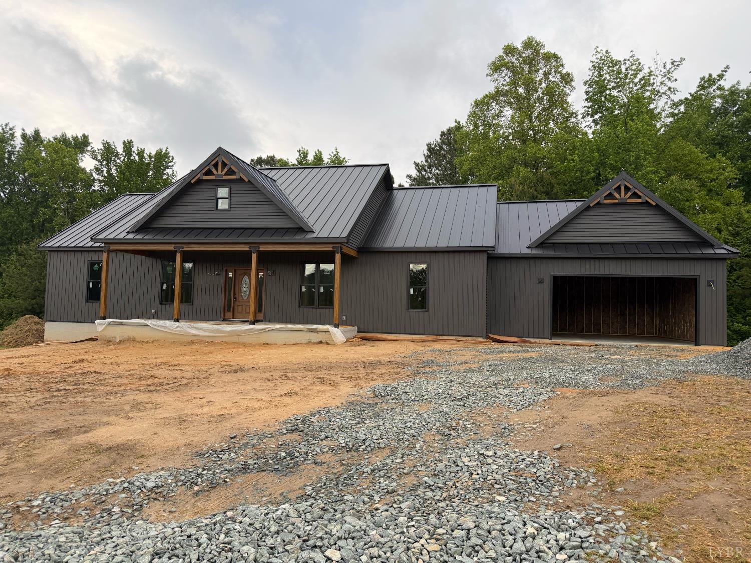 2794 Cow Road Buffalo Junction, VA 24529 - Photo 2 of 16 a front view of a house with a garden