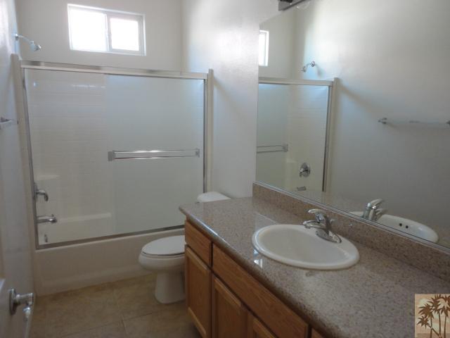 49473 Wayne Street Indio, CA 92201 - Photo 14 of 20 a bathroom with a sink toilet and shower
