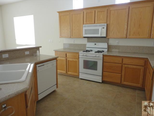49473 Wayne Street Indio, CA 92201 - Photo 6 of 20 a kitchen with cabinets appliances and a sink