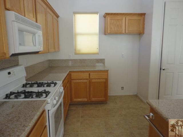 49473 Wayne Street Indio, CA 92201 - Photo 7 of 20 a kitchen with a stove and a refrigerator