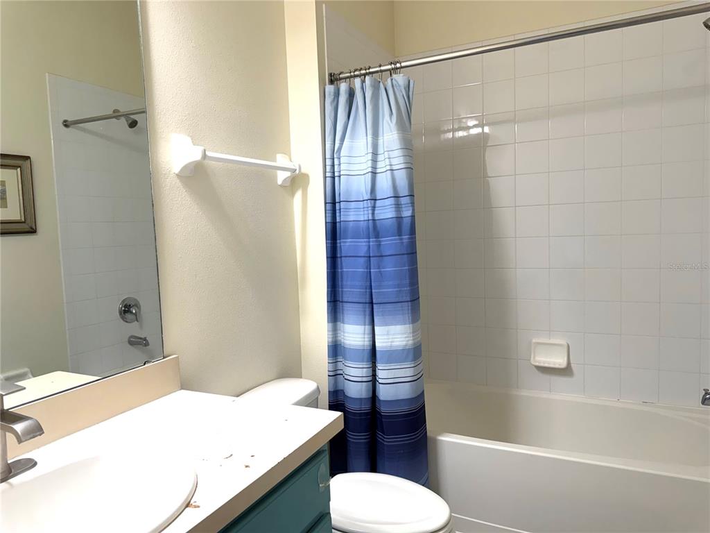 4573 Ada Lane Kissimmee, FL 34746 - Photo 10 of 37 a bathroom with a sink and toilet