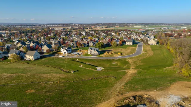 an aerial view of swimming pool a yard and mountain view