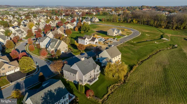 a view of a house with swimming pool and porch
