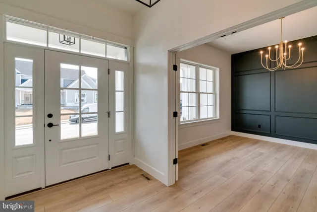 a bathroom with a granite countertop double vanity sink and a mirror