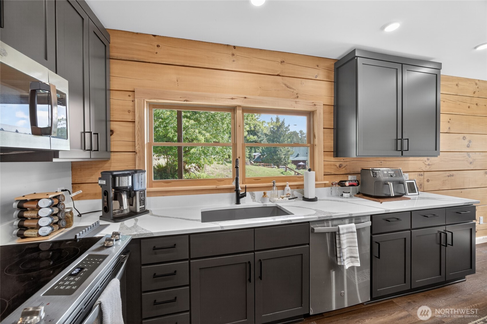 180 Carr Road Randle, WA 98377 - Photo 11 of 40 a kitchen with a sink stove and cabinets