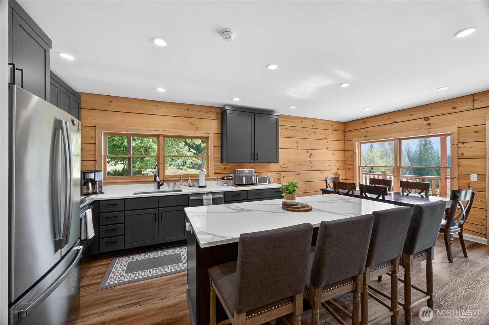 180 Carr Road Randle, WA 98377 - Photo 12 of 40 a kitchen with granite countertop a sink stove and refrigerator