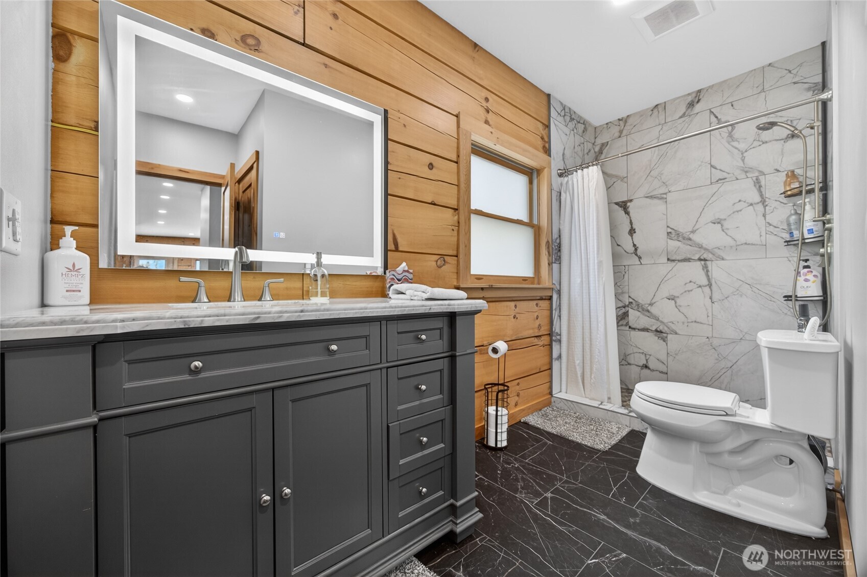 180 Carr Road Randle, WA 98377 - Photo 21 of 40 a bathroom with a double vanity sink toilet and shower
