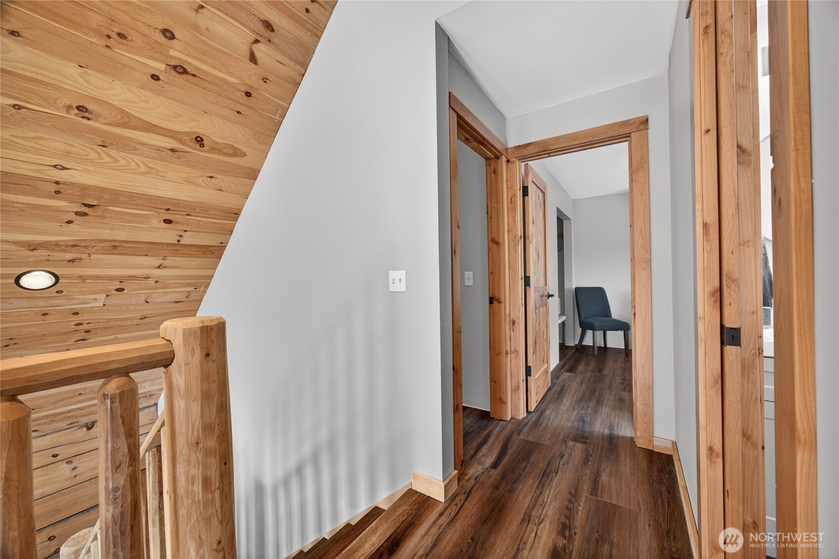 180 Carr Road Randle, WA 98377 - Photo 26 of 40 a view of a hallway with wooden floor and staircase