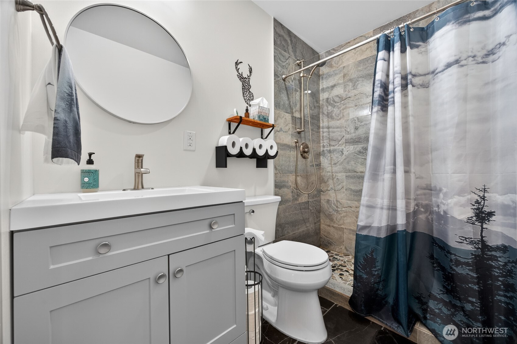 180 Carr Road Randle, WA 98377 - Photo 31 of 40 a bathroom with a sink a toilet and a mirror