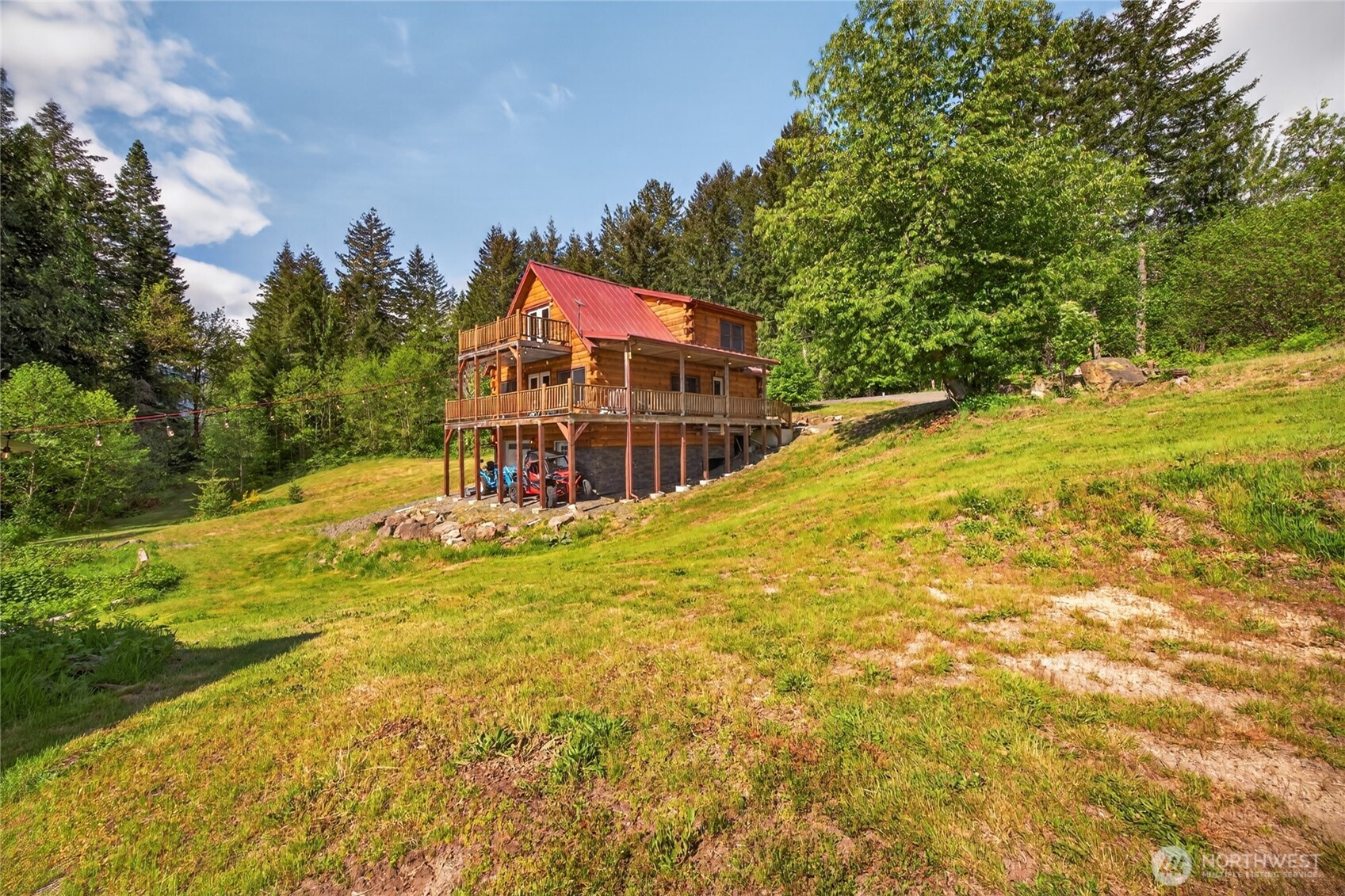 180 Carr Road Randle, WA 98377 - Photo 39 of 40 a view of a swimming pool with an outdoor space and seating area