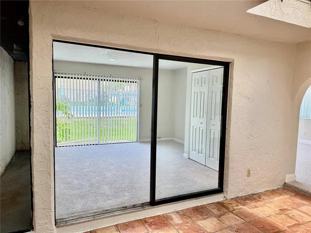 a bathroom with a granite countertop toilet sink and mirror