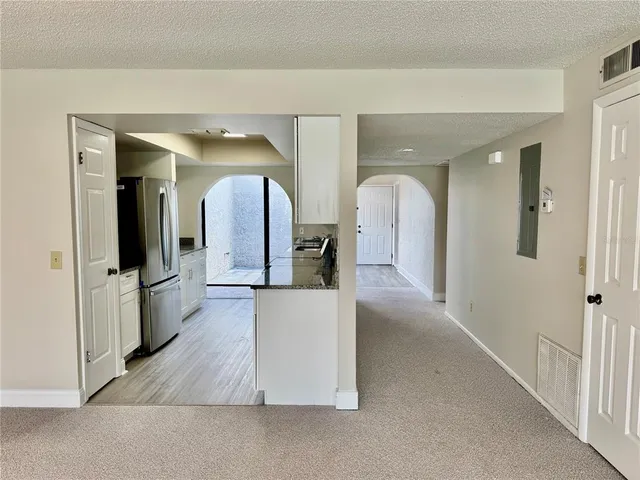 a view of an empty room with a balcony