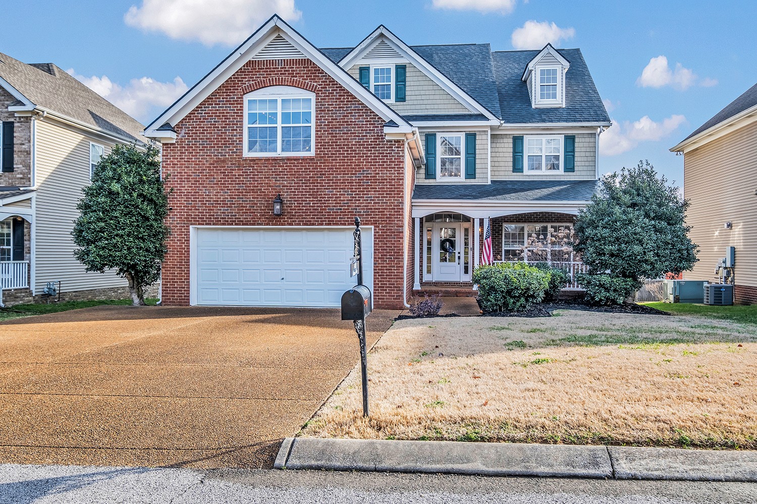 4002 Marion Drive Spring Hill, TN 37174 - Photo 1 of 44 a front view of a house with a yard and garage
