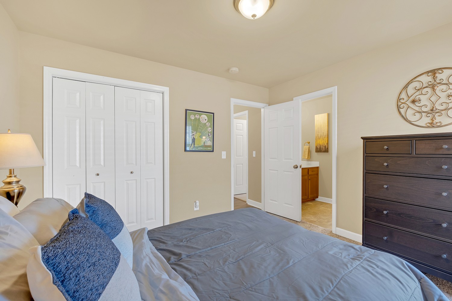 4002 Marion Drive Spring Hill, TN 37174 - Photo 35 of 44 a spacious bedroom with a bed and a dresser in it