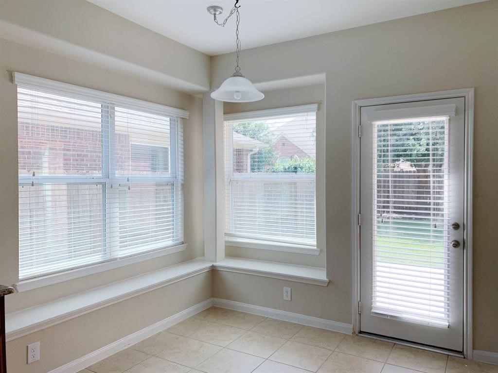 24418 Ranchwood Springs Lane Katy, TX 77494 - Photo 11 of 29 a view of an empty room with a window