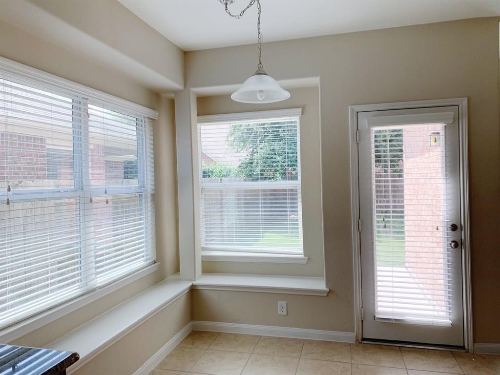 24418 Ranchwood Springs Lane Katy, TX 77494 - Photo 12 of 29 a bathroom with a large window and a chandelier