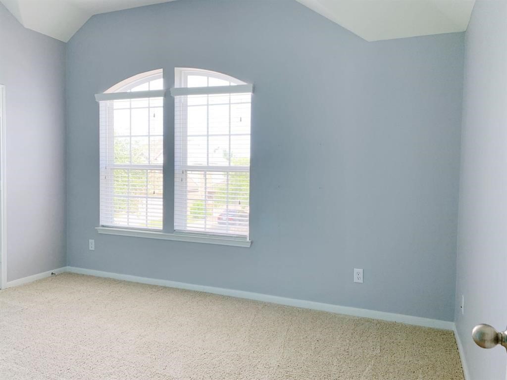 24418 Ranchwood Springs Lane Katy, TX 77494 - Photo 24 of 29 an empty room with a window