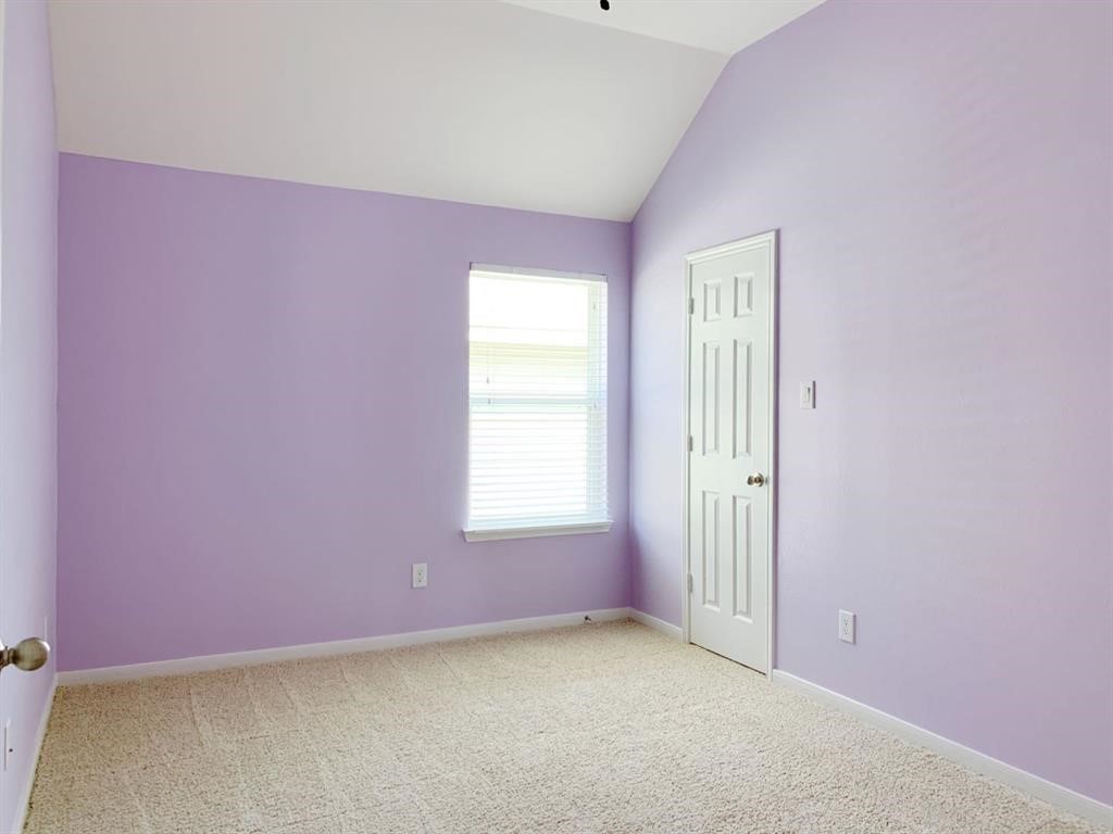 24418 Ranchwood Springs Lane Katy, TX 77494 - Photo 25 of 29 an empty room with windows