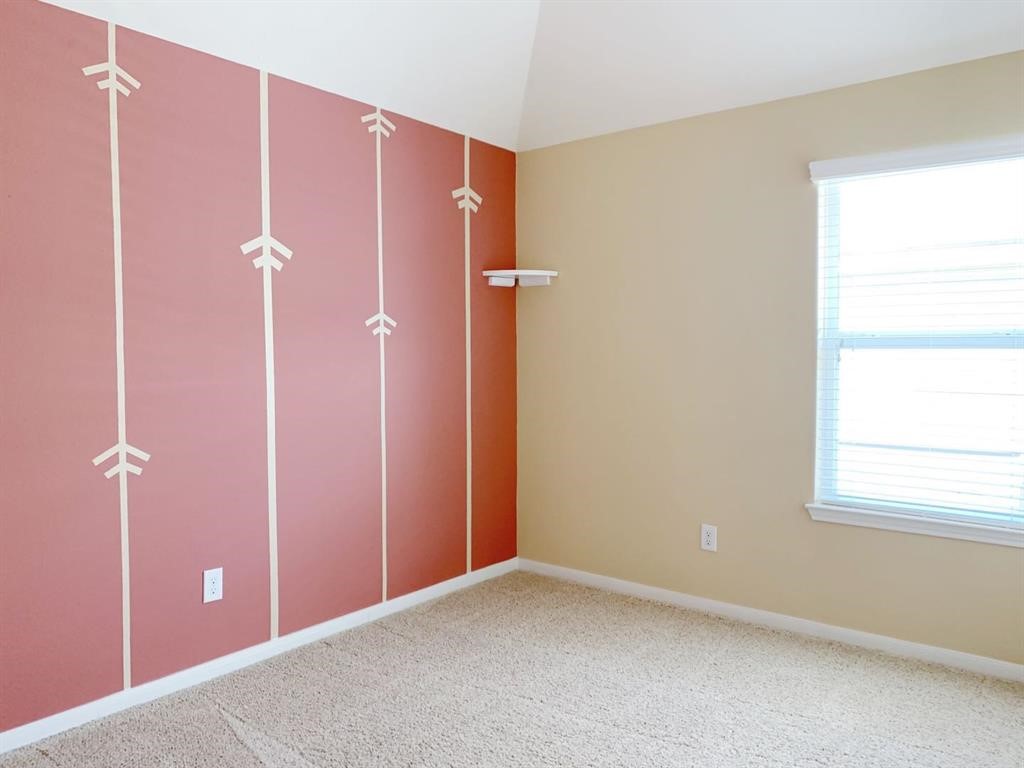 24418 Ranchwood Springs Lane Katy, TX 77494 - Photo 27 of 29 an empty room with windows and closet