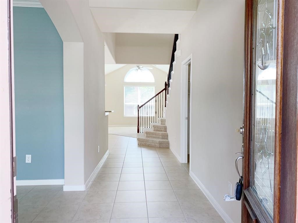 24418 Ranchwood Springs Lane Katy, TX 77494 - Photo 3 of 29 a view of a hallway