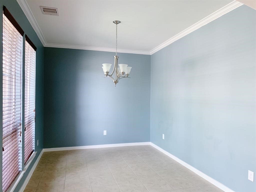 24418 Ranchwood Springs Lane Katy, TX 77494 - Photo 4 of 29 a view of an empty room with a window