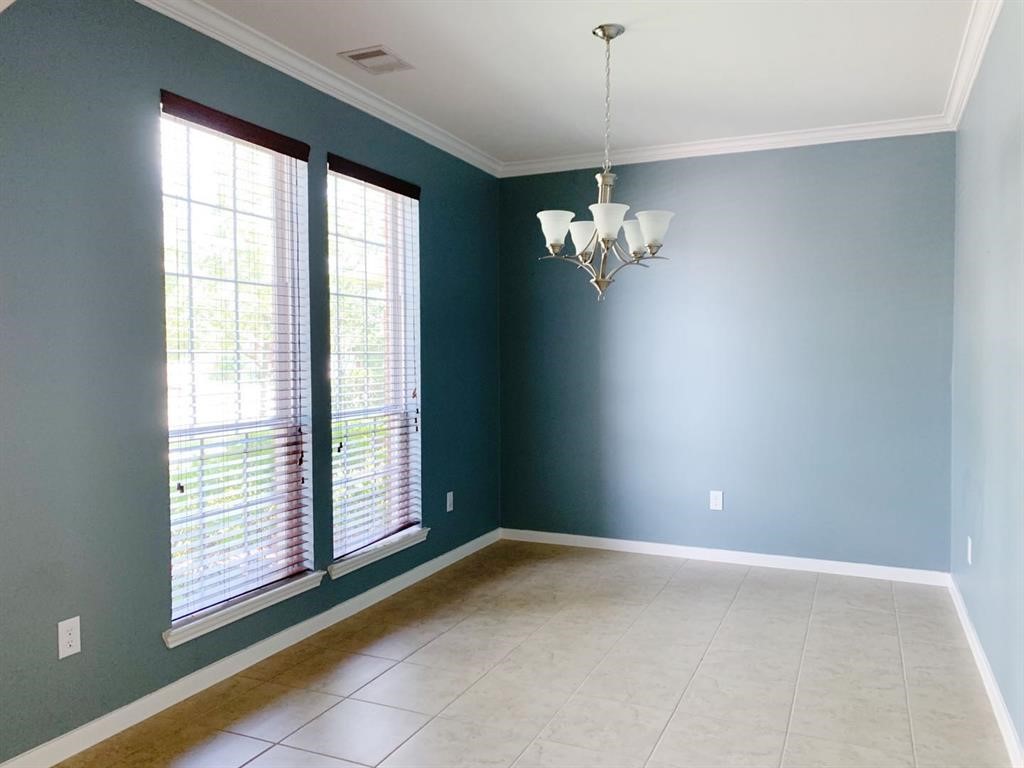 24418 Ranchwood Springs Lane Katy, TX 77494 - Photo 5 of 29 a view of an empty room with a window