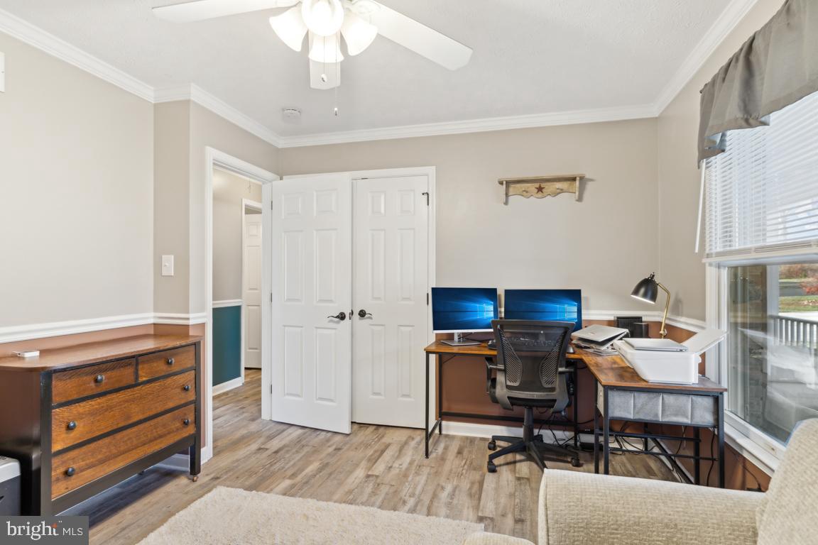 20 Cox Road Colora, MD 21917 - Photo 12 of 38 a workspace with furniture a chandelier and a window