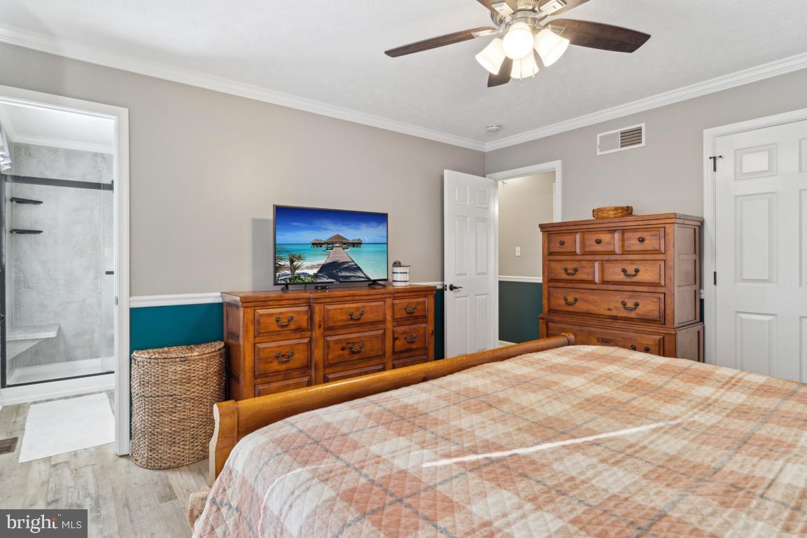20 Cox Road Colora, MD 21917 - Photo 14 of 38 a bedroom with a bed and a dresser