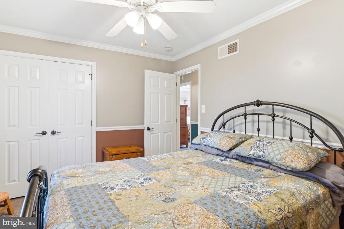 20 Cox Road Colora, MD 21917 - Photo 17 of 38 a bedroom with a bed and a dresser