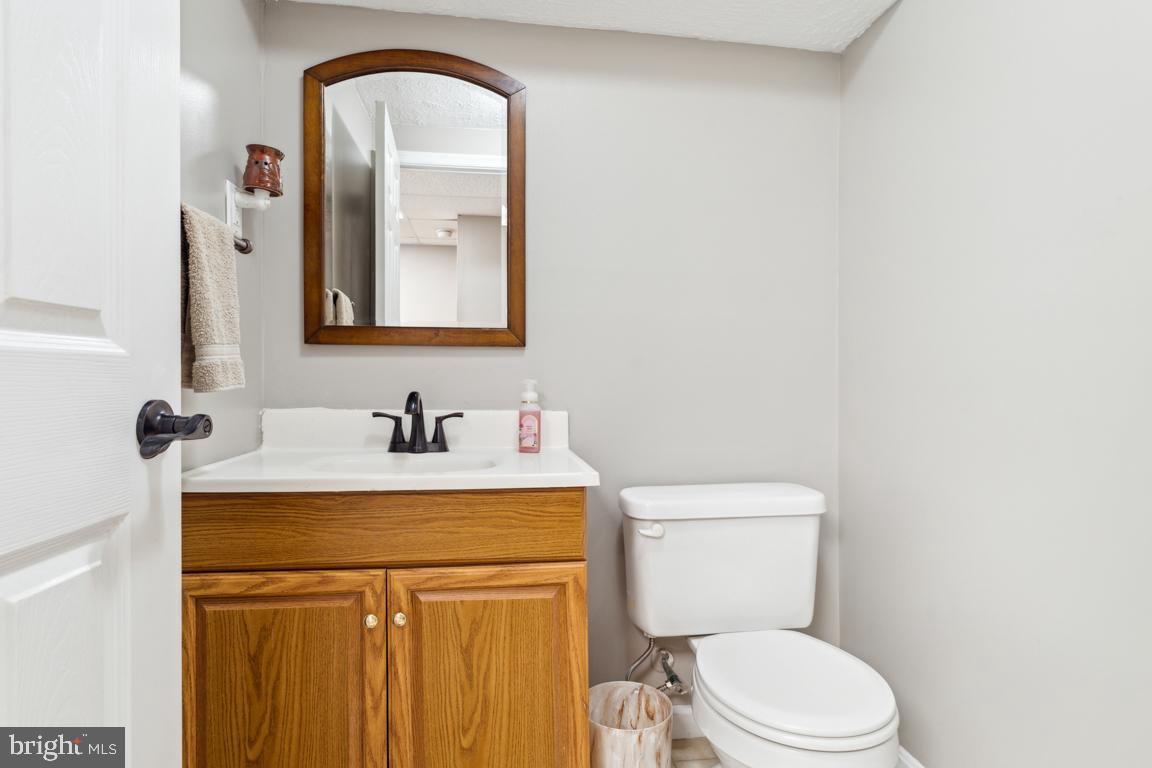 20 Cox Road Colora, MD 21917 - Photo 20 of 38 a bathroom with a toilet sink vanity and mirror