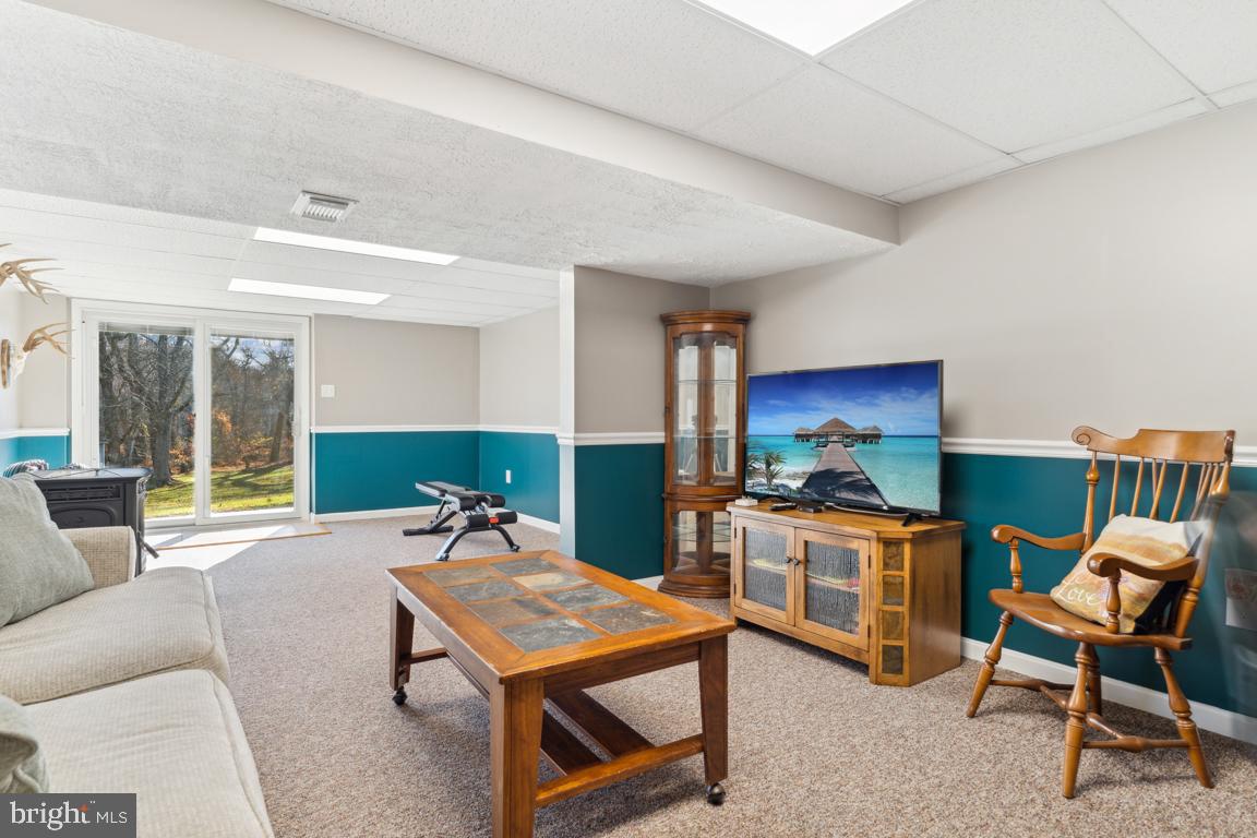 20 Cox Road Colora, MD 21917 - Photo 21 of 38 a living room with furniture a rug and a table