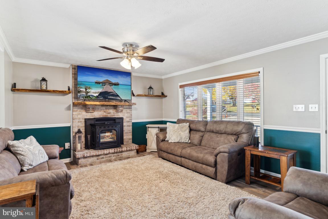 20 Cox Road Colora, MD 21917 - Photo 4 of 38 a living room with furniture a fireplace and a window