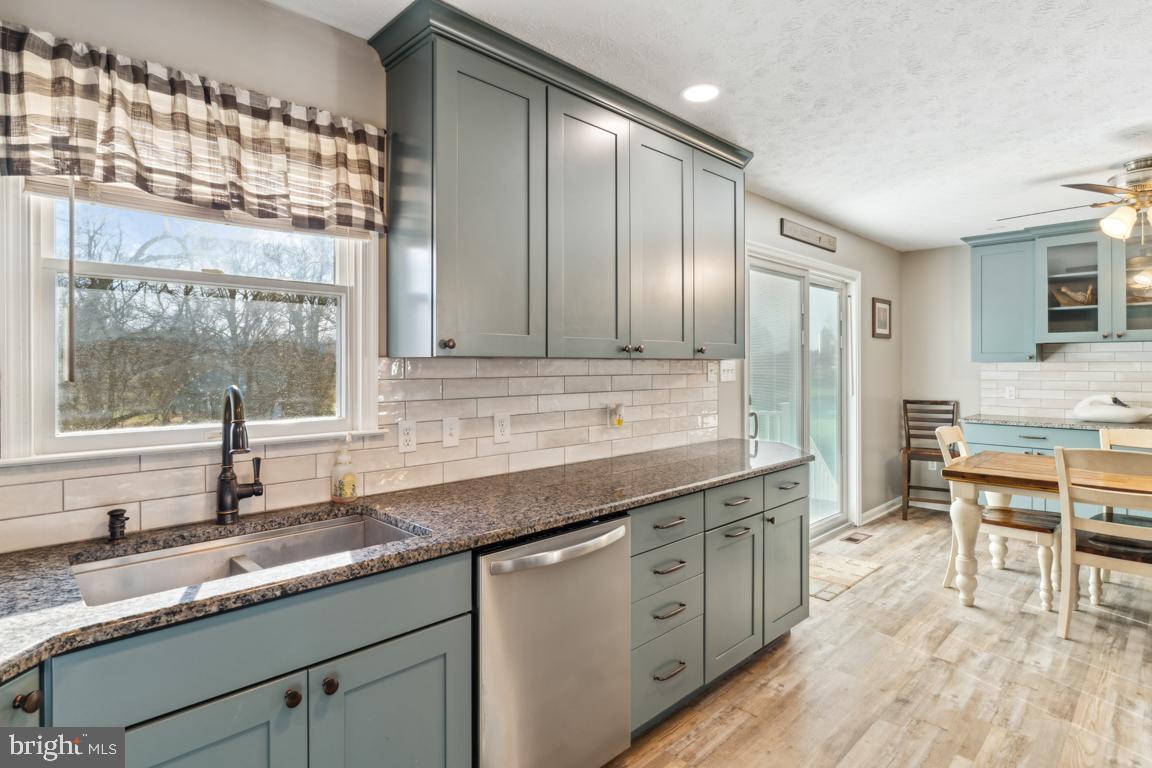 20 Cox Road Colora, MD 21917 - Photo 9 of 38 a kitchen with granite countertop stainless steel appliances a sink and cabinets