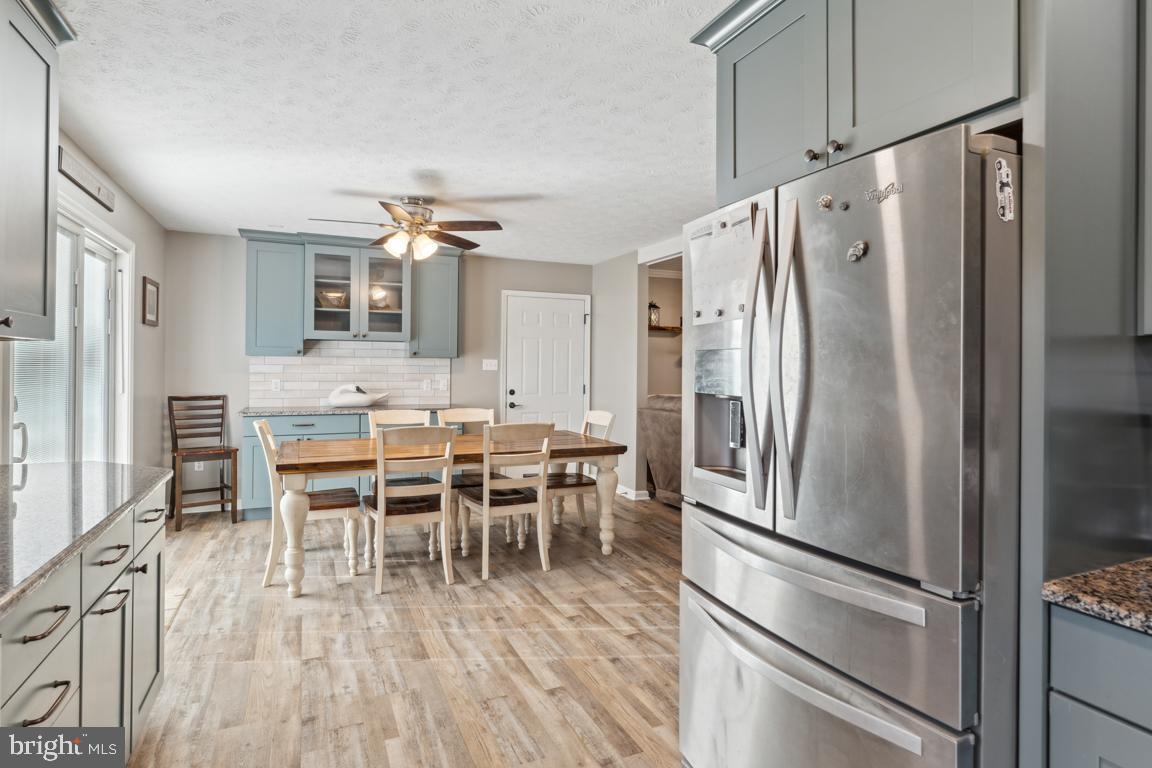 20 Cox Road Colora, MD 21917 - Photo 10 of 38 a kitchen with stainless steel appliances a refrigerator and a dining table