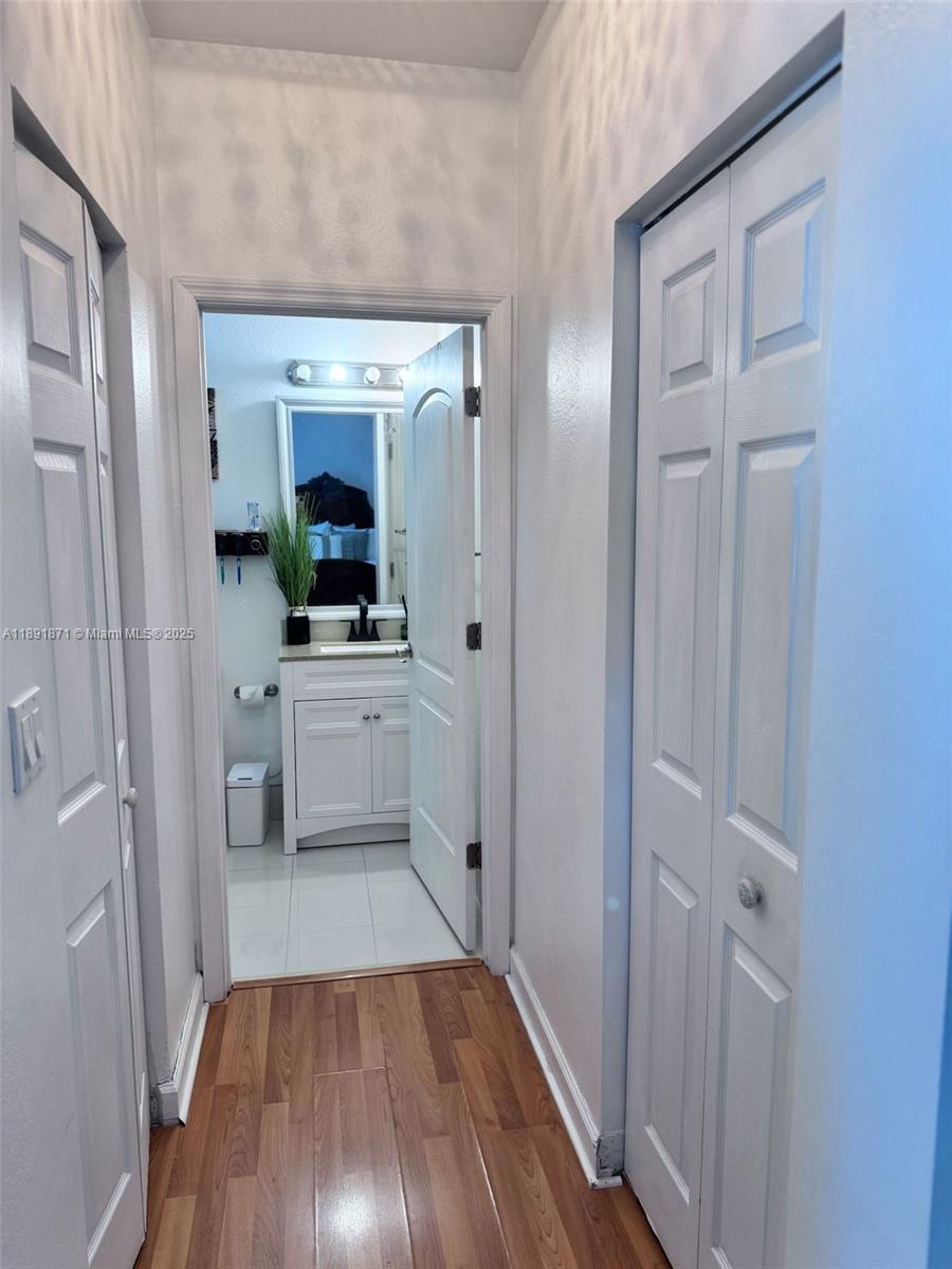 11041 Southwest 246th Street Homestead, FL 33032 - Photo 11 of 25 a view of a hallway and wooden floor