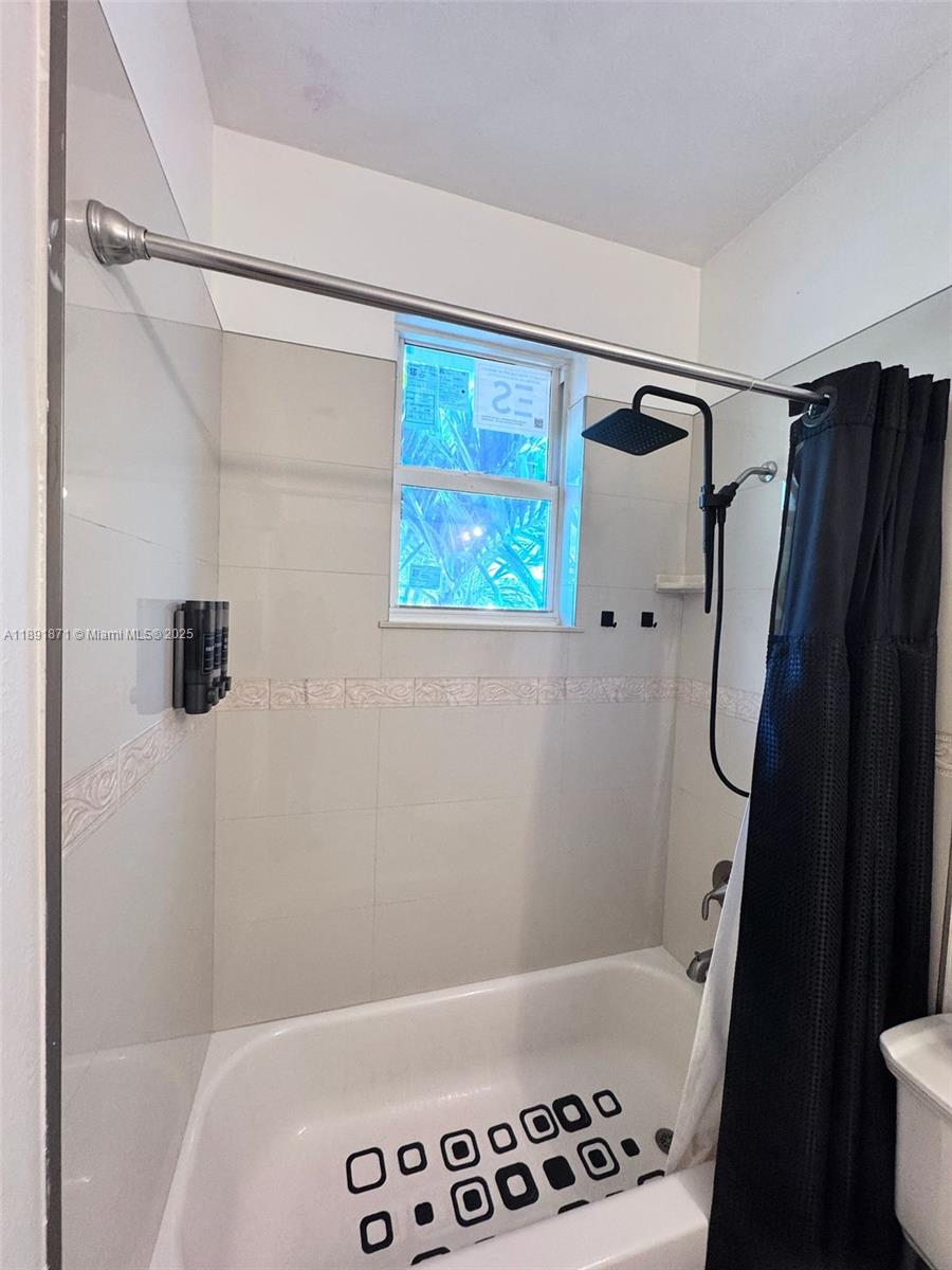 11041 Southwest 246th Street Homestead, FL 33032 - Photo 14 of 25 a bathroom with a bathtub and a shower