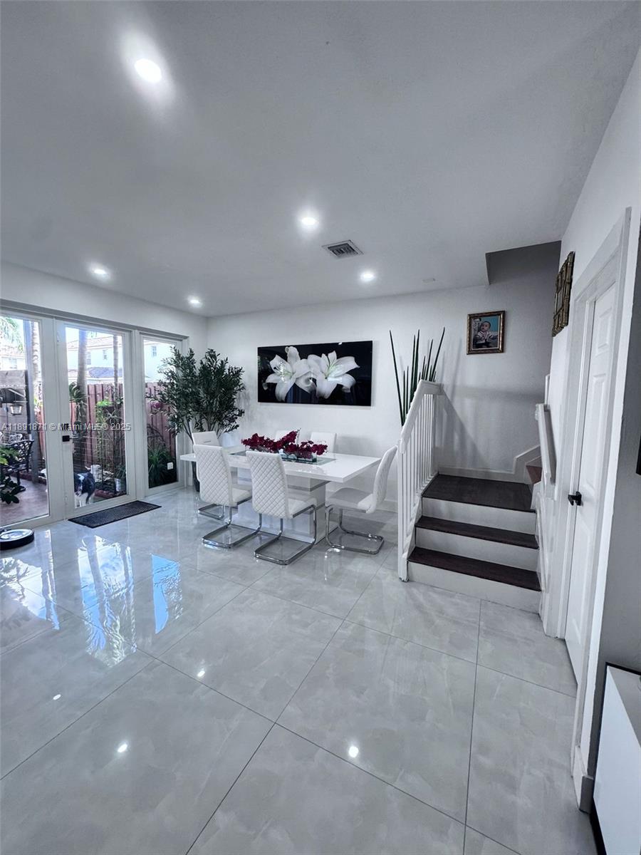 11041 Southwest 246th Street Homestead, FL 33032 - Photo 5 of 25 a living room with furniture and a rug