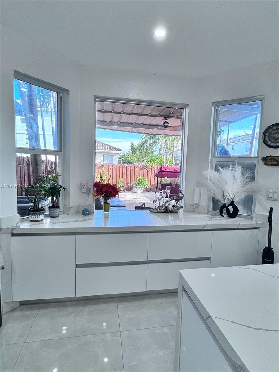 11041 Southwest 246th Street Homestead, FL 33032 - Photo 8 of 25 a kitchen with a sink and large window