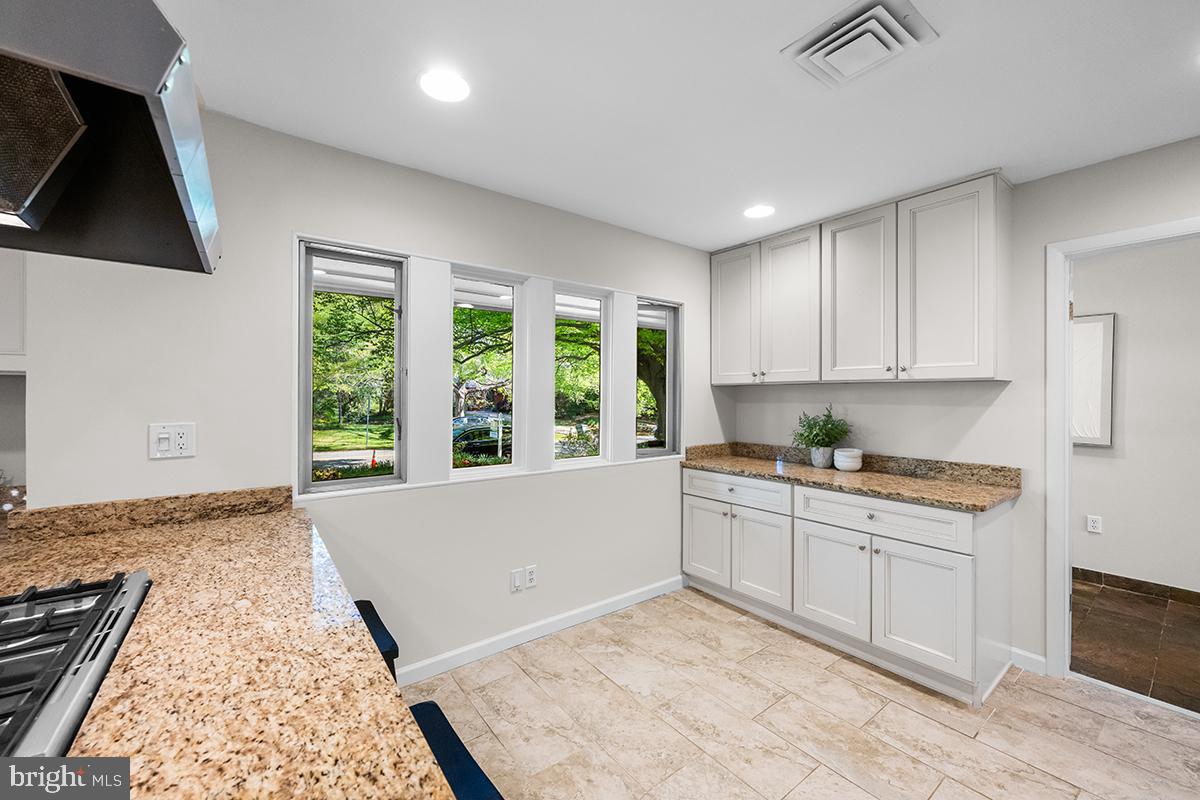 3430 Blair Road Falls Church, VA 22041 - Photo 11 of 40 a kitchen with a stove a sink and a refrigerator