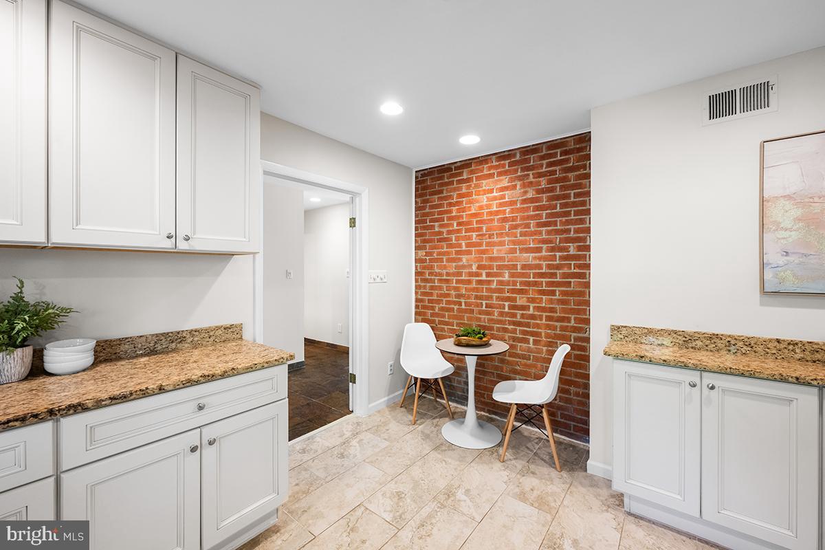 3430 Blair Road Falls Church, VA 22041 - Photo 12 of 40 a room with granite countertop furniture and a window