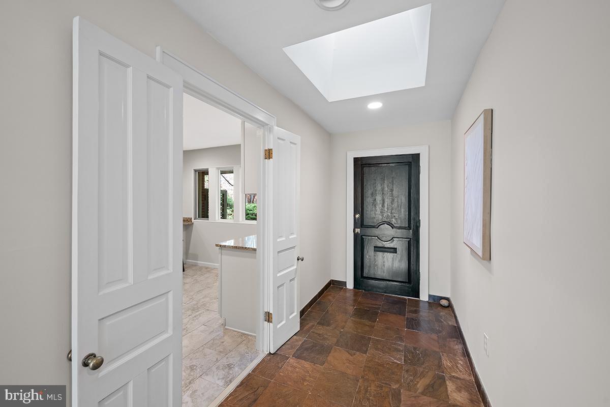 3430 Blair Road Falls Church, VA 22041 - Photo 2 of 40 a view of a hallway with a livingroom and wooden floor