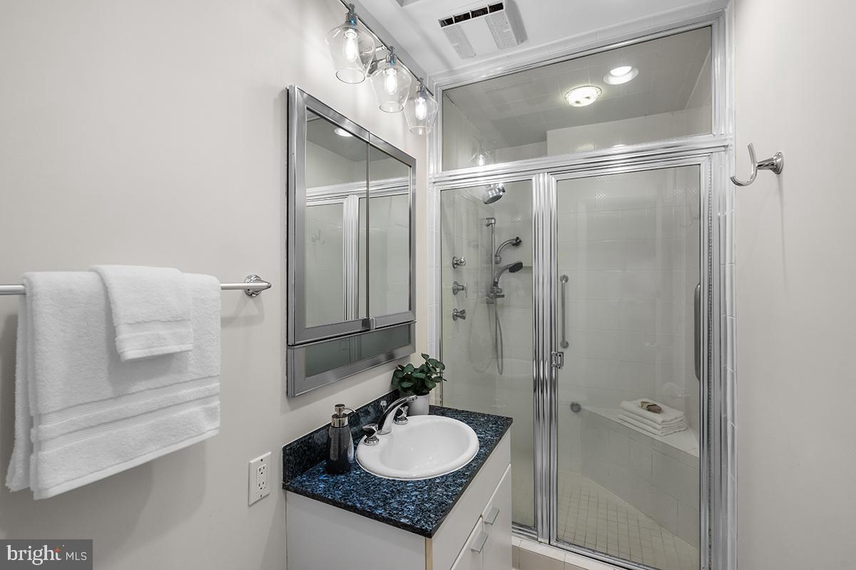 3430 Blair Road Falls Church, VA 22041 - Photo 21 of 40 a bathroom with a granite countertop sink and a mirror