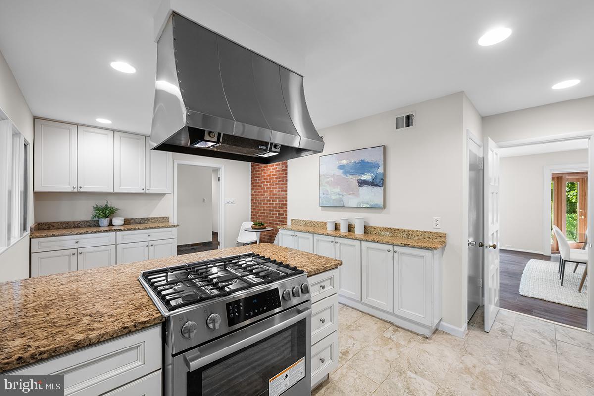 3430 Blair Road Falls Church, VA 22041 - Photo 10 of 40 a kitchen with stainless steel appliances granite countertop a stove and a sink