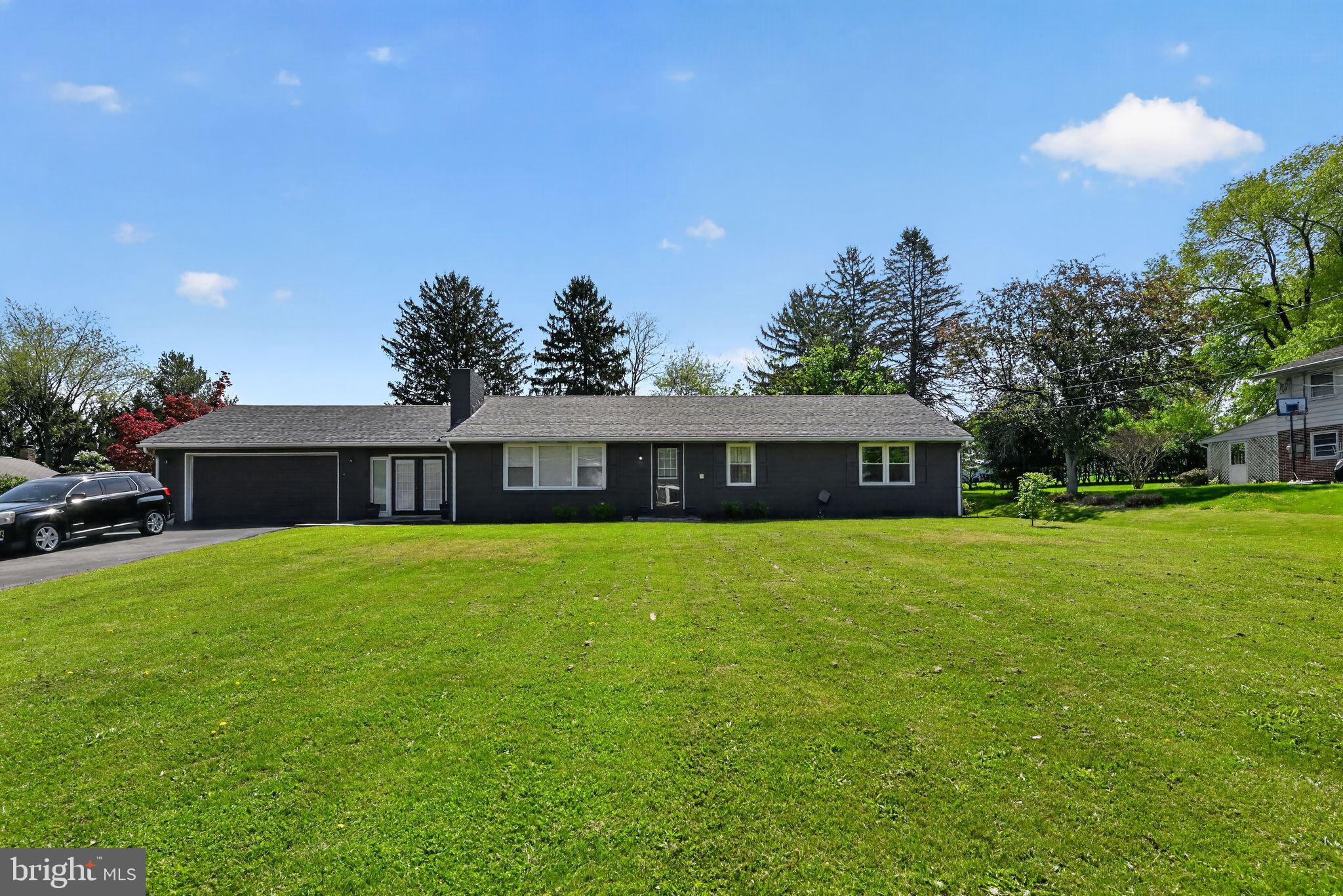 525 Mountain Road Dillsburg, PA 17019 - Photo 1 of 53 a front view of a house with a garden