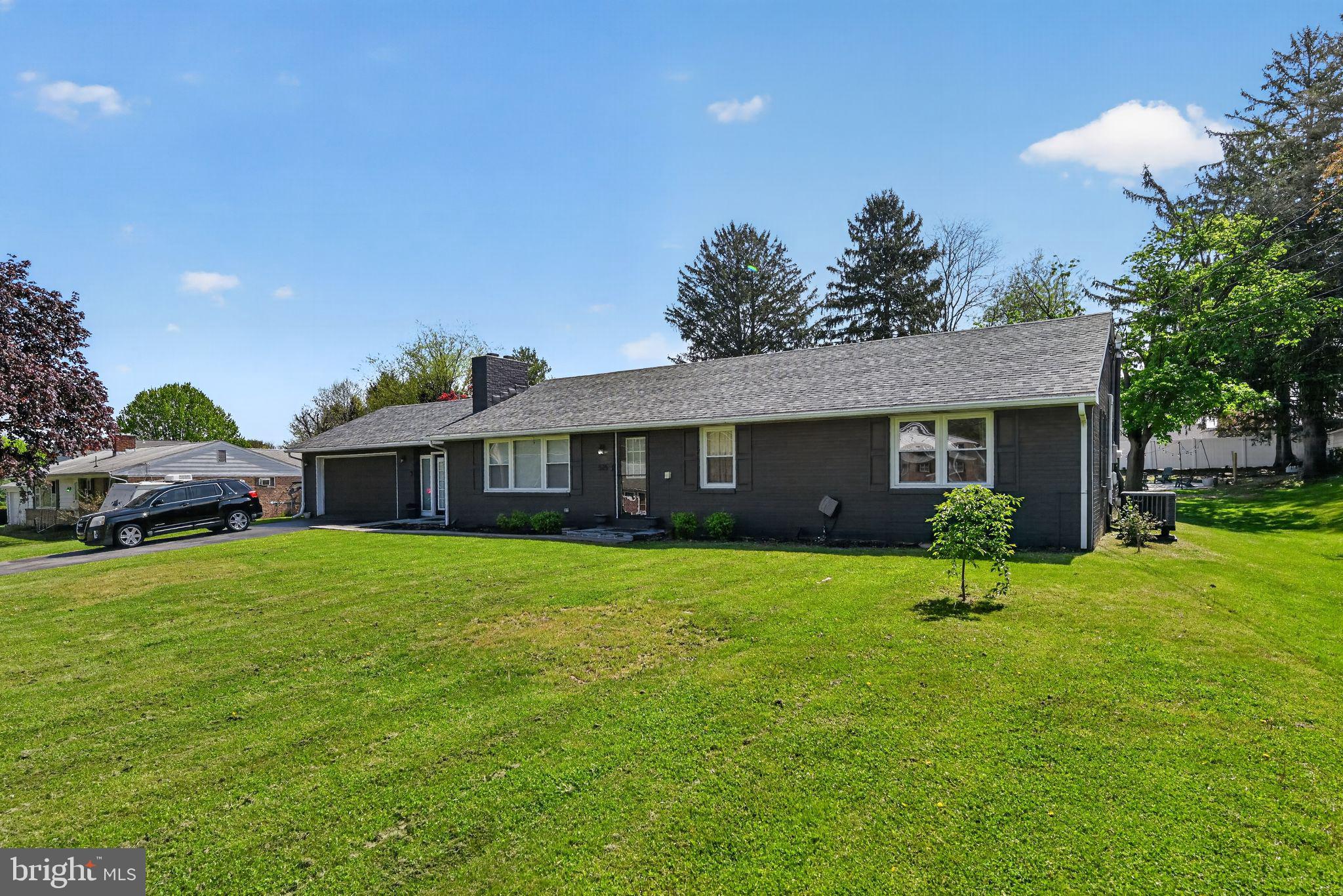 525 Mountain Road Dillsburg, PA 17019 - Photo 3 of 53 a front view of a house with a garden