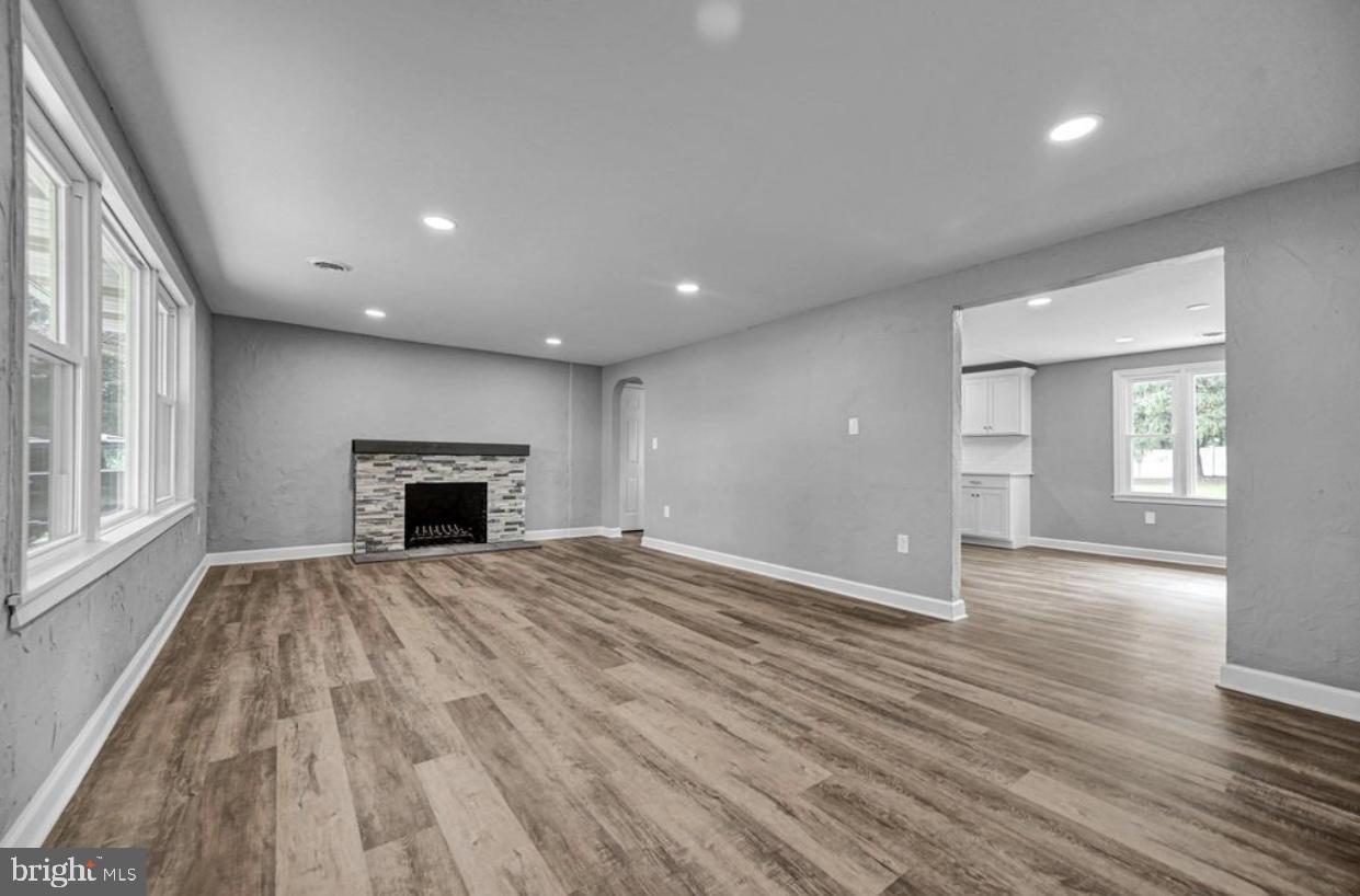 525 Mountain Road Dillsburg, PA 17019 - Photo 31 of 53 a view of empty room with wooden floor and fireplace