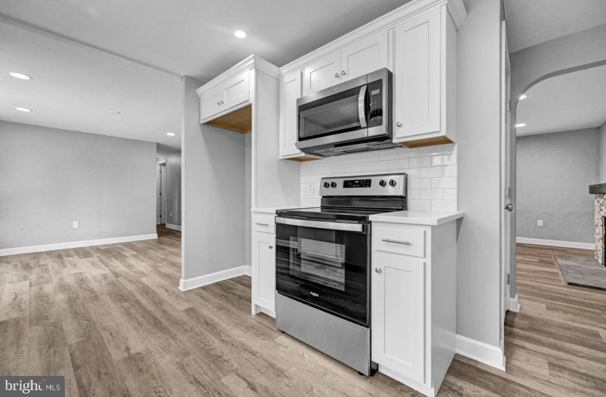 525 Mountain Road Dillsburg, PA 17019 - Photo 35 of 53 a kitchen with stainless steel appliances a stove a microwave and cabinets